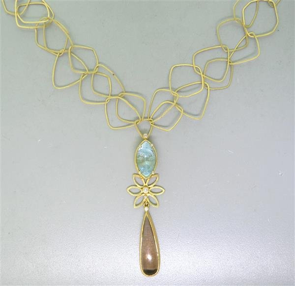 18K Gold Aquamarine Topaz Diamond Necklace: Necklace features aquamarine - 20mm x 10.5mm, Topaz - 35mm x 10mm at widest point, Diamonds. Necklace wearable length is 16" long. Marked - JC, 18K, Weight - 27.1g