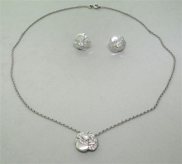 Chanel Camellia 18k Gold Diamond Earrings Necklace: Set comes with photocopies of Chanel certificates of authenticity. Necklace - 15" long,pendant is 13mm x 12mm. Earrings - 12mm x 11mm. Total diamonds - approx. 0.60ctw. Earrings do not bear Chane