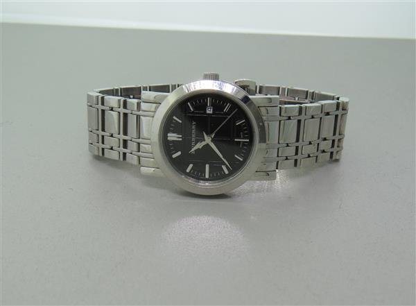 Burberry Stainless Steel Watch: Case 38mm in diameter.,excl lug tips and crown. Original band and hidden deployant buckle. Date at 3 o'clock. Quartz movement.Will fit up to 6" wrist.