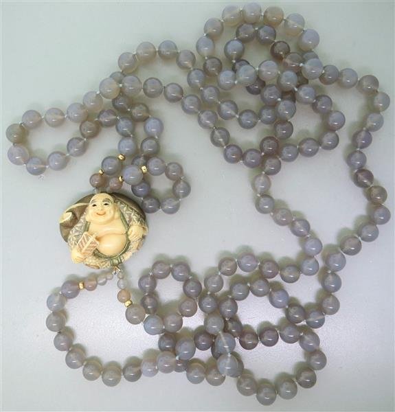 Gray Moonstone Gold Netsuke Necklace: Necklace is 36" long (no opening clasp) Gray moonstone beads - 10.3mm, netsuke figurine pendant - 38mm x 43mm x 20mm. 246.8g