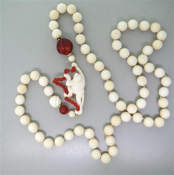 Carved Bone Carnelian Monkey Necklace: Necklace is 39" long (no opening clasp), monkey pendant - 62mmx 28mm. Carnelians - 4mm. 10.5mm, 19.3mm in diameter. Bone beads 10.4mm in diameter. Gold spacers. weight - 114.3g