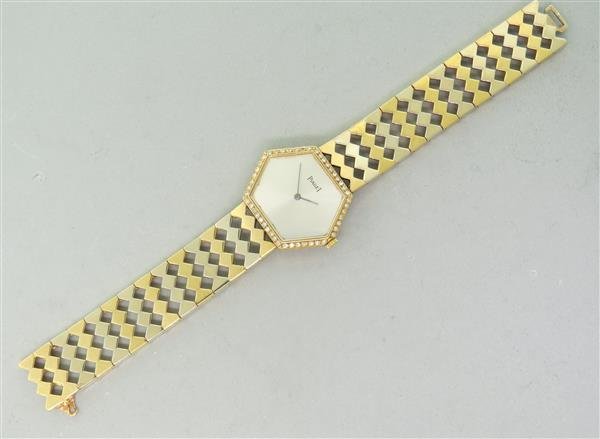Piaget 18k Gold Diamond Watch w. Box: Case 28mm excl. crown x 23mm. Bracelet is 6 1/2" long. Diamond bezel.Screw down case, manual movement - working order