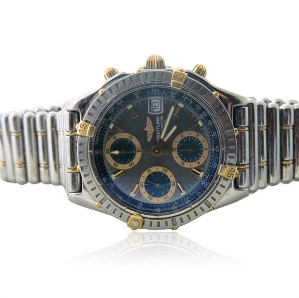 Breitling Chronomat 18k Gold Steel Watch ref. B13352: Case is 38mm in diameter. Bullet bracelet. Automatic movement,3 reg. chronograph. date at 3 o'clock. Ref/ B13352. running order