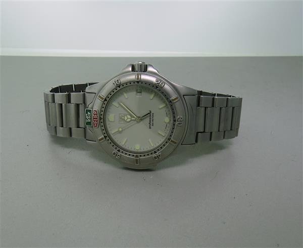 Tag Heuer Professional 4000 Series Mens Watch 999.706: 38mm Stainless Steel Case. Unidirectional Rotating Bezel. Functions: Hours, Minutes, Seconds, Date. Quartz Movement. Full Bracelet. Working Order.