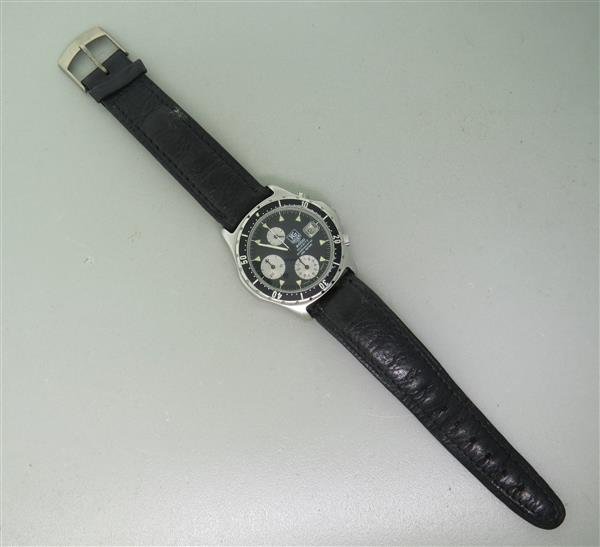 Tag Heuer 2000 Series Chronograph Mens Watch: 40mm Stainless Steel Case. Unidirectional Rotating Bezel. Functions: Hours, Minutes, Seconds, Date, Chronograph. Quartz Movement. Band / Buckle not original. Working Order.