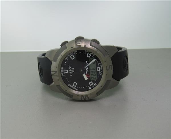 Tissot T Touch Titanium Mens Watch: 41mm Titanium Case. Bidirectional Rotating Bezel. Touch Screen. Electronic LCD Battery Powered Movement. Working Order.