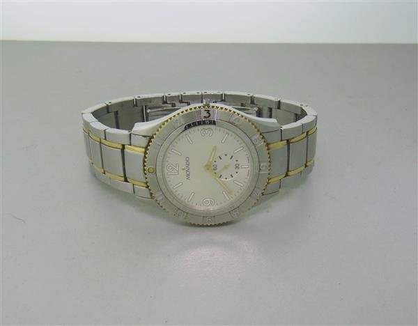 Movado Stainless Steel Mens Watch: 35mm Stainless Steel Case. Fixed Bezel. Functions: Hours, Minutes, Seconds. Quartz Movement. Running Order. Missing Crown.