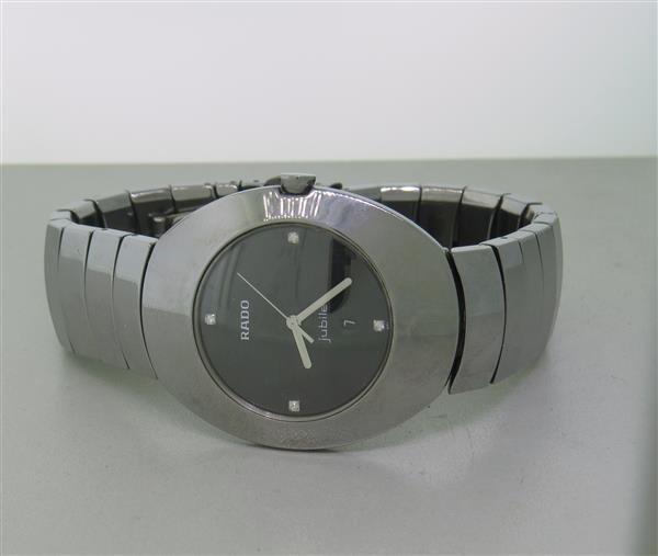 Rado Jubile Ceramic Diamond Watch: Oval shape case - 34mm x 41mm exlc. crown. quartz movement - running. Black dial with 4 diamond markers, center second hand,date at 6 o'clock. High-tech ceramic bracelet.