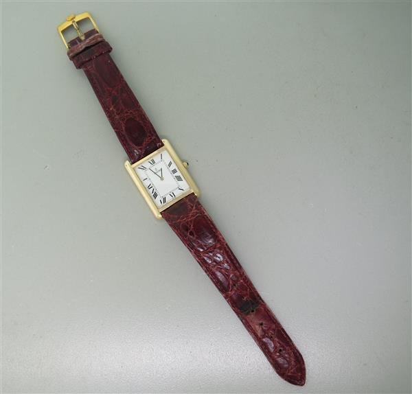 Concord 14k Gold Mens Watch: 33mm x 25mm 14k Yellow Gold Case. Roman Numeral Dial. Functions: Hours, Minutes. Quartz Movement. Running Order