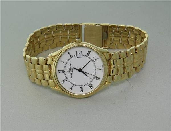 Baume & Mercier 14k Gold Watch Bracelet: 14k gold case - 31mm in diameter. Quartz movement - running order. White dial with black roman numerals, date at 3 o'clock. Original 14k gold bracelet - 8" long. weight of the watch - 68.6gr