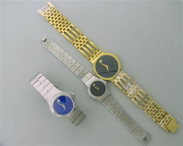 Movado Stainless Steel Watch Lot 3: Cases are 33mm , 27mm and 24mm in diameter. All quartz movements - running order. Blue and black dials.