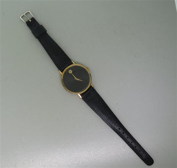 Museum Movado Gold Tone Watch: Case - 31mm in diameter. Quartz movement - not running.