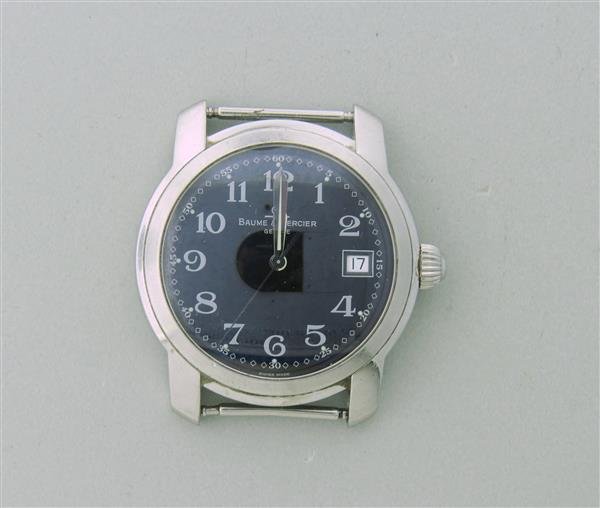 Baume & Mercier Capeland Stainless Steel Watch: Steel case - 36mm in diameter excl .crown and lug tips. Movement - quartz,not running. Black dial,numerals markers,date at 3 o'clock,center second hand.