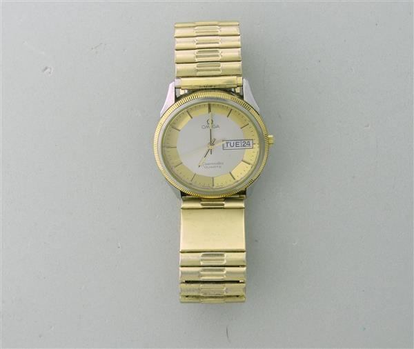 Omega Seamaster Day Date Gold Plate Steel Watch: 18k gold electroplated /steel case - 32mm in diameter. Quartz movement - not running. Hubnail bezel,gold/silver tone dial,date & date at 3 o'clock.