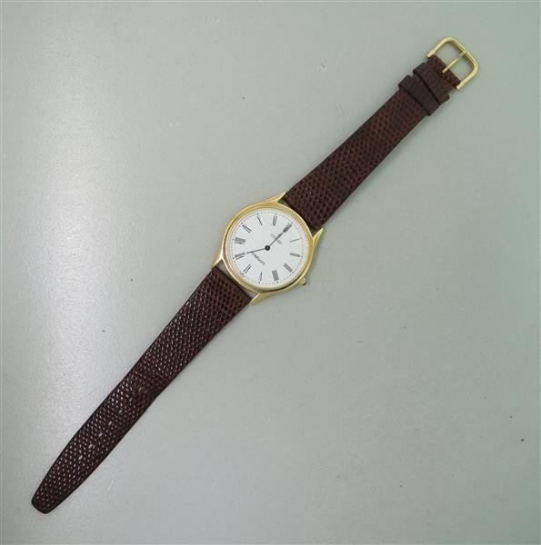 Concord 14k Gold leather Band Watch: 14k gold case - 33mm in diameter. Quartz movement - not running. Sapphire crown,white dial with roman numerals.