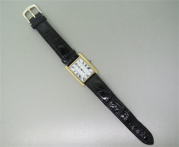 Concord 14k Gold Leather Band Watch: 14k gold case - 25mm excl crown x 34mm lug tip to lug tip. Sapphire crown. Quartz movement - running order. White dial with roman numerals.