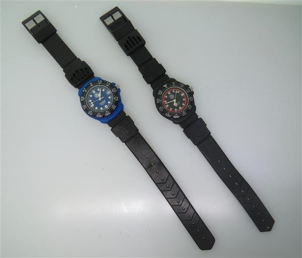 Tag Heuer Formula 1 Watch Lot of 2: two Tag Heuer watches - case35mm in diameter excl .crown. Blue and black case,rotating bezel with indicators, Luminous hands ad markers,date at 3 o'clock. Original rubber bands. Quartz - not runni