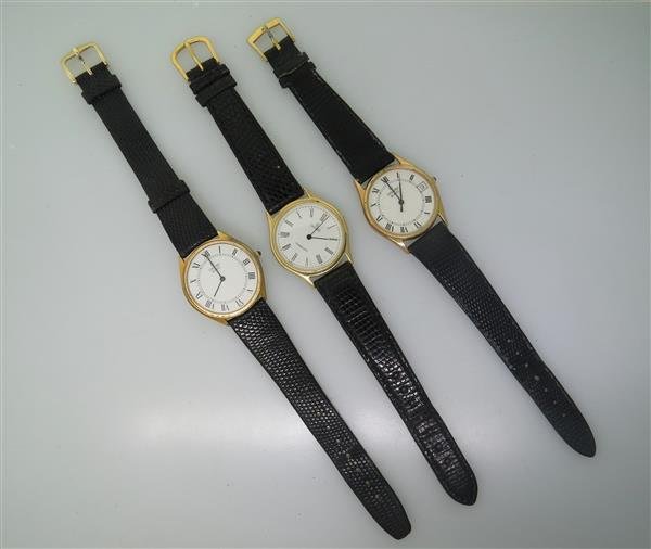 Lot of Three Concord Mens Watches: Three Concord Mens Watches. Gold Tone 33mm Case. Roman Numeral Dial. Quartz Movement. One Watch Has Skewed Dial, Missing Crown. Watches Not Running.