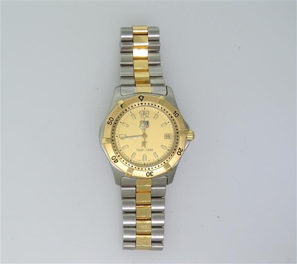 Tag Heuer Professional Stainless Steel Watch WK1121: Two tone case - 36mm in diameter excl .crown. Quartz movement - not running. Gold tone dial,luminous markers and hands. Date at 3 o'clock. Rotating bezel.Original band and buckle.