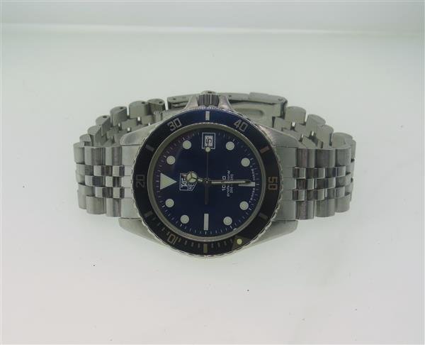 Tag Heuer 1000 Professional Watch 980613: Case - 37mm in diameter. Quartz movement - running order. Luminous hands and markers, blue dial and rotating bezel with indicators,date at 3 o'clock. Original buckle.