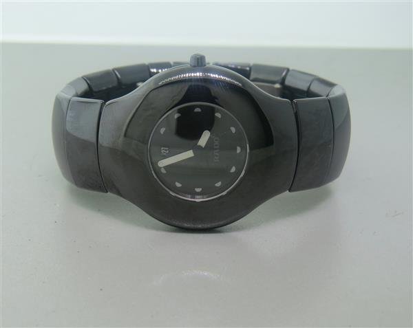 Rado Xeramo Ceramic Watch: High tech scratchproof and watersealed case - 35mm in diameter. Quartz movement - running order. Black dial with silver tone markers and hour/minute hands, date at 12 o'clock. Crystal has a scratc