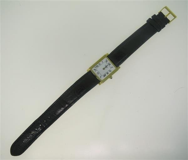 Universal Geneve 14k Gold Watch: 14k gold case - 24mm excl crown x 24mm excl lugs. White dial with black roman numerals. Quartz movement - not running. Missing hour hand.