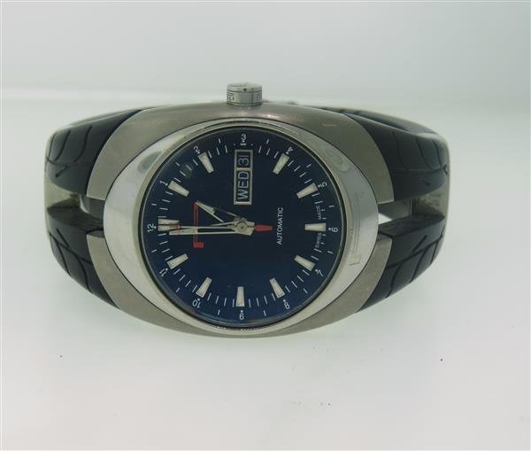 Pirelli P Zero Tempo Automatic Day Date Watch: Stainless steel and titanium case - 36mm excl crown x 47mwith lugs. Automatic movement - running order. Day date at 3 o'clock,center second hand,original dial. Original rubber band and buckle.