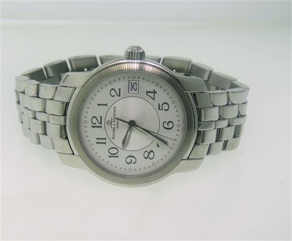 Baume & Mercier Capeland Stainless Steel Watch: Steel case - 36mm in diameter. Quartz movement - running order. Original dial with arabic numerals,date at 3 o'clock,center second hand.