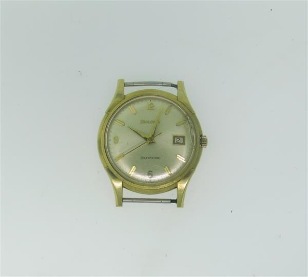 Vintage Bulova 14k Gold Automatic Watch: 14k gold case - 34mm in diameter. Self winding automatic movement - running order. Center second hand,date at 3 o'clock. crystal - broken.