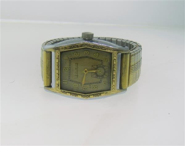 1920s Two Tone Bulova Tonneau Shape Watch: Tonneau two tone case - 25mm excl crown x 29mm excl lugs. Manual wind - not running. Triple signed,small second hand at 6 o'clock,original dial.