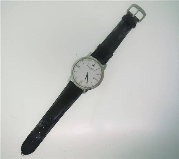 Baume & Mercier Stainless Steel Watch: Steel case - 41mm in diameter. Quartz movement - not running. White dial with silver note roman numerals,date at 3 o'clock.