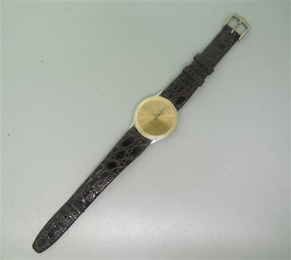 Concord Marines SL Gold Tone Watch: Case - 33mm in diameter. Quartz movement - not running. Gold tone dial with stick markers