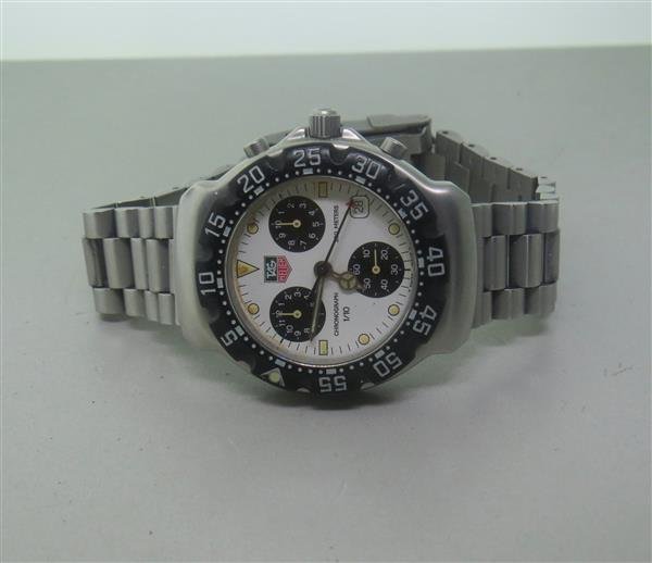 Tag Heuer Professional Chronograph Watch D95724: Steel case - 37mm in diameter. Quartz - not running. Rotating bezel, white dial wtih 3 reg. chronograph,date at 4 o'clock. Original band and buckle. Specks on dial