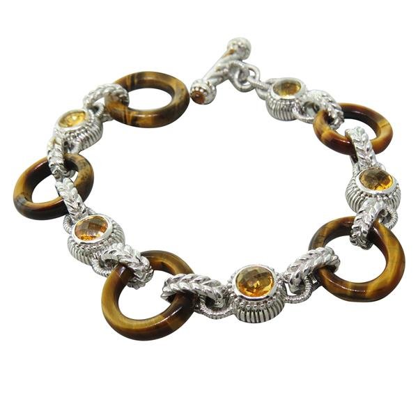 Judith Ripka Sterling Silver Tigers Eye Gemstone Toggle: Bracelet is 8" end to end, 7" wearable length. Tigers eye links are 16mm in diameter. Marked Judith Ripka 925 Thailand. Weight - 24.8g