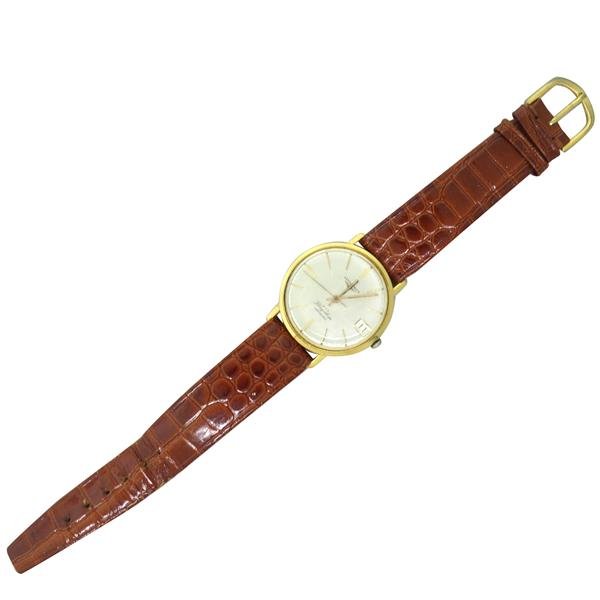 Longines 18k Gold Flagship Automatic Watch cal 345: 18k gold case - 35mm in diameter. Automatic movement - running order,17 jewels,cal. 345. Longines signed dial,gold stick markers,center second hand,date at 3 o'clock.Some scratches on dial.discolo