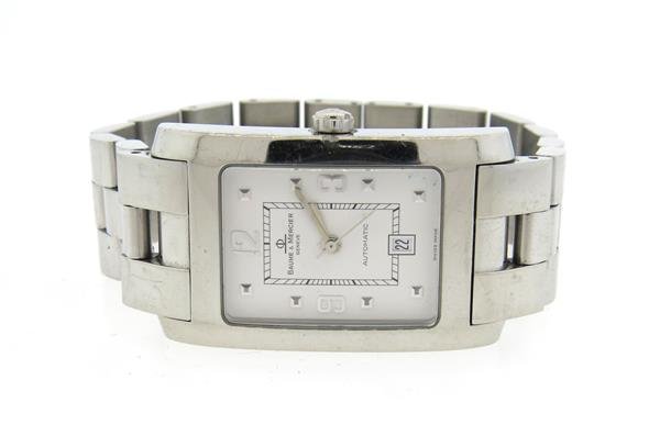 Baume & Mercier Automatic Stainless Steel Watch: Case - 24mm excl crown x 38mm lug tip to lug tip. Automatic movement - not running. White dial with silvered markers, date at 6 o'clock. Original band and buckle.