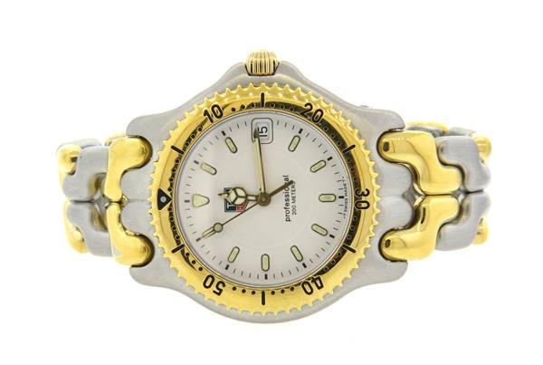 Tag Heuer Link Two Tone Professional Watch X63666: Two tone case - 37mm in diameter. Rotating bezel, white dial with date at 3 o'clock,luminous markers and hands. Two tone band, original buckle. Quartz movement - running order.Watches are guarante