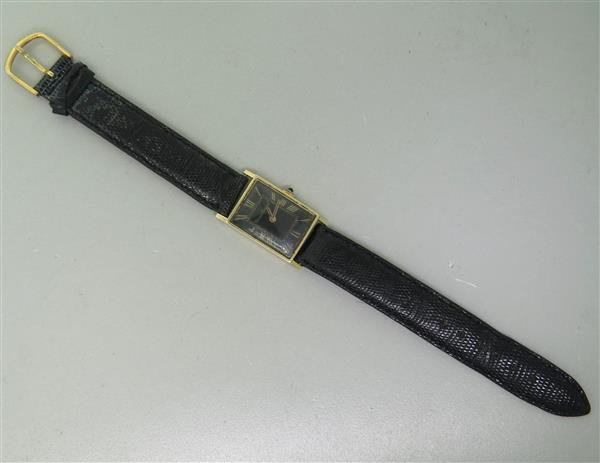 Lucien Piccard 14k Gold Manual Wind Watch: 14k gold case - 19mm excl crown x 33mm lug tip to lug tip. manual wind - running order. Black dial with gold roman numerals, some scratches on crystal.Watches are guaranteed to be in running order, if