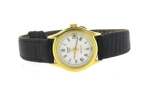 Concord Tiffany & Co 14k Gold Watch: 14k gold case - 22mm excl crown x 25mm lug tip to lug tip. Quartz - running order. White dial signed Concord and Tiffany & co, black roman numerals , date at 3 o'clock, center second hand.