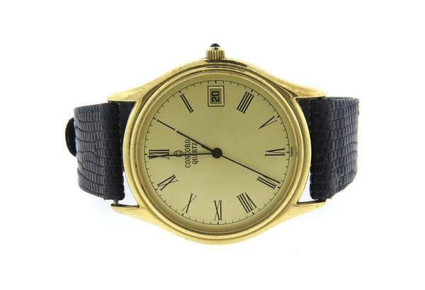Concord 14k Gold Leather Band Watch: 14k gold case - 33mm in diameter. Gold dial with black roman numeral markers, center second hand, date at 3 o'clock. quartz - running orderWatches are guaranteed to be in running order, if describ