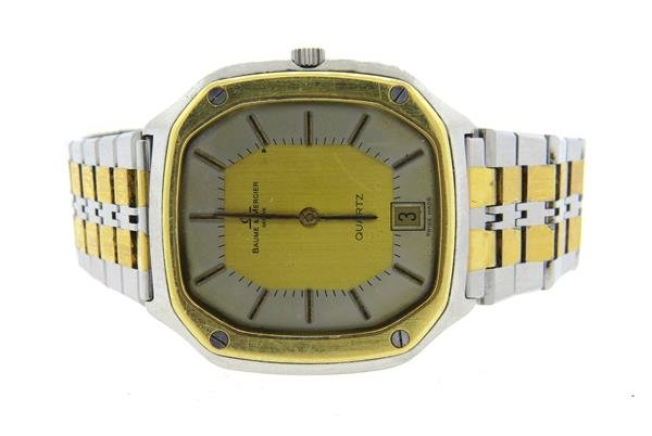 Baume & Mercier Two Tone Watch: Case - 36mm excl crown x 38mm lug tip to lug tip. Quartz movement - not running. Two tone dial with stick markers, date at 6 o'clock.