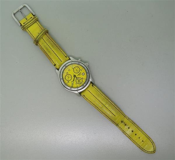 Tissot Stainless Steel Yellow Dial Chronograph Watch: Case - 38mm in diameter. Quartz movement - running order. Yellow dial with 3 reg. chronograph, date at 4 o'clock. Chronograph feature is not working - watch is missing a pusher.Watches are guarant