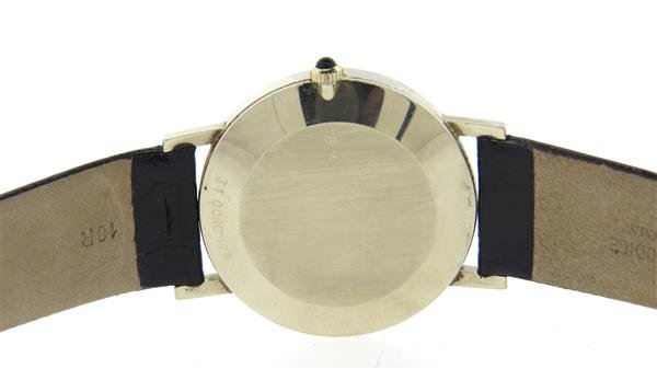 Movado Zenith 18k White Gold Diamond Watch: 18k white gold case 34mm in diameter. Black dial with diamond marker at 12 o'clock. Manual wind movement, signed Zenith, 17 jewels - running order. Case and dial signed. Band does not close, impro