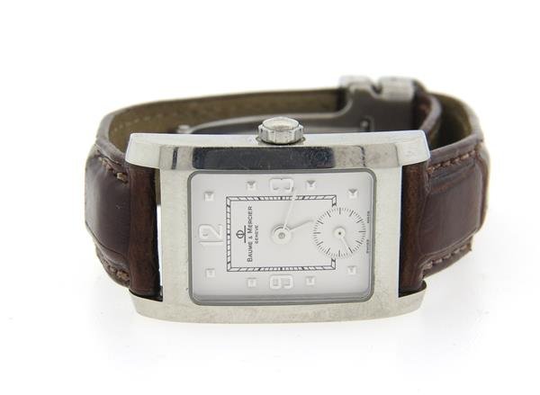 Baume & Mercier Stainless Steel Watch: Case - 20mm excl crown x 33mm lug tip to lug tip. White dial, small second hand at 6 o'clock. Original buckle. Quartz - running orderWatches are guaranteed to be in running order, if described as