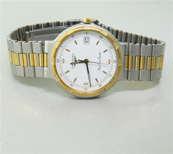 Longines Conquest Two Tone Watch: Case - 33mm in diameter. White dial with gold stick markers, center second hand, date at 3 o'clock. Quartz movement - running order.Watches are guaranteed to be in running order, if described as s