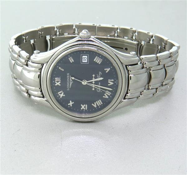 Longines Golden Wing Stainless Steel Watch: Case is 32mm in diameter. Blue dial with silvered roman numeral markers, center second hand, date at 3 o'clock. Quartz movement - running order. Original band and buckle.Watches are guaranteed to