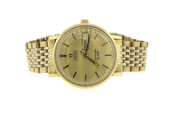 1980s Omega Seamaster De Ville Day Date GF Watch: Gold filled case - 34mm in diameter. Automatic movement - running order. Gold tone dial with gold stick markers, center second hand, day and date at 3 o'clock. Watches are guaranteed to be in runn