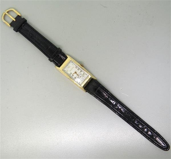 1940s Bulova 14k Gold Tank 45mm Case Watch: 14k gold case - 19mm excl crown x 45mm lug tip to lug tip. Manual wind movement - running order. Small second hand at 6 o'clock. Watches are guaranteed to be in running order, if described as such