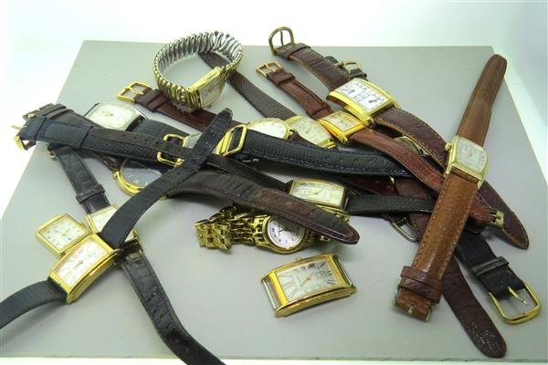 Hamilton Watch Lot of 17: Lot of 17 Hamilton watches. Functions - center second hand, small second hand at 6 o'clock, date at 3 o'clock. Some are missing bands. All quartz movements - not running.Watches are guaranteed