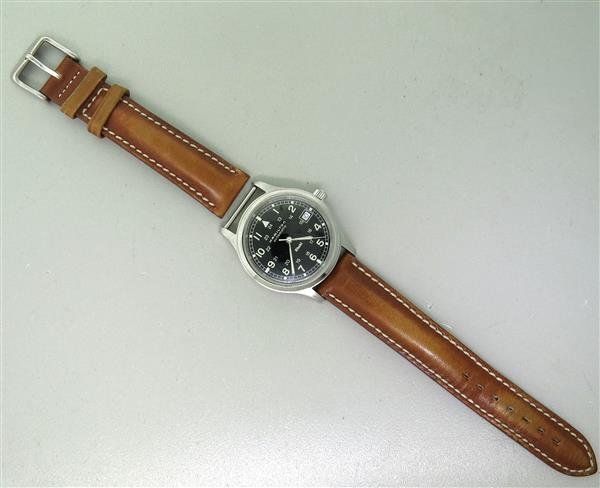 Hamilton Khaki Automatic Skeleton Back Watch: Case - 36mm in diameter, Automatic movement - running order. Skeleton back, black dial with center second hand, date at 3 o'clock. Watches are guaranteed to be in running order, if described as su